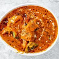 Chicken Tikka Masala (Chefs Specialty) · Boneless grilled chicken cooked with tomato, cream, and special spices. A divine buttery tas...