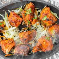 Tandoori Chicken (Full) · Grilled bone-in chicken marinated in yogurt, garlic, ginger, and fresh ground spices.