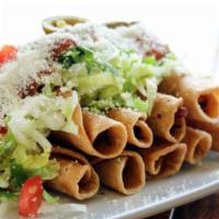 Platter #5 Flautas · Three corn tortillas rolled up with ground beef, shredded beef or shredded chicken, and deep...
