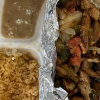 Fajita · Available in chicken or steak and accompanied with rice, beans, and tortillas. Served with g...