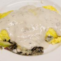 Loon Omelet · Two eggs with Minnesota wild rice, mushrooms, onions, turkey, tomatoes, provolone cheese and...
