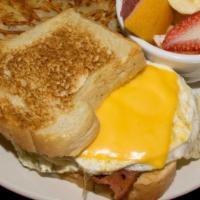 Keys Eggswich · Two eggs fried hard, with cheese and choice of meat on toast or grilled bun served with hash...