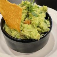 Guacamole · Made with fresh avocados, onions, tomatoes, and cilantro.
