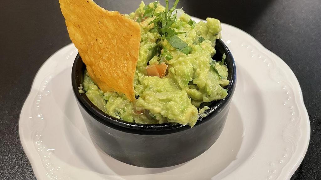 Guacamole · Made with fresh avocados, onions, tomatoes, and cilantro.