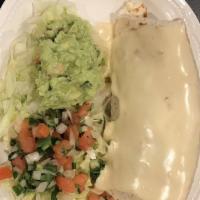 Burrito Grande · Flour tortilla stuffed with grilled chicken or carnitas, rice and refried beans and covered ...