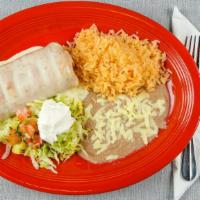 Chimichanga · Chicken tinga or ground beef, stuffed into a flour tortilla, deep-fried, and topped with our...