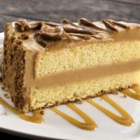 Cookie Butter Cream Cake · Moist vanilla cake layered with decadent cookie butter cream,  surrounded by Biscoff cookie ...