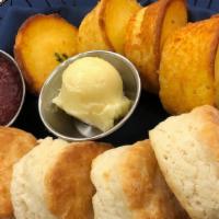 Southern Bread Basket · Three buttermilk biscuits and three cornbread muffins with seasonal jam and whipped honey bu...