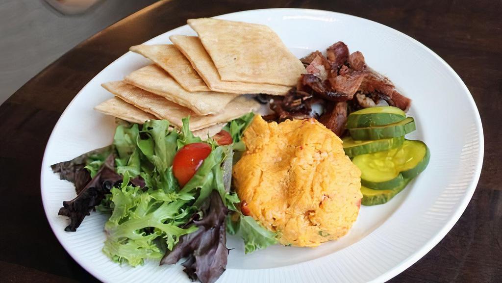 Pimento Cheese Plate · with house buttermilk crackers, candied pecans, bread & butter pickles and pecan-smoked bacon crumbles.