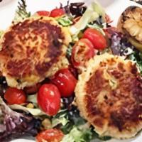 Crab Cake Salad · Two pan-seared crab cakes, mixed greens, zucchini, squash, bell pepper, onion, lima beans, c...