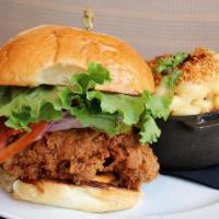 Fried Chicken Sandwich · with Bubba’s remoulade, tomato, lettuce, and bread-and-butter pickles, on South Union brioch...