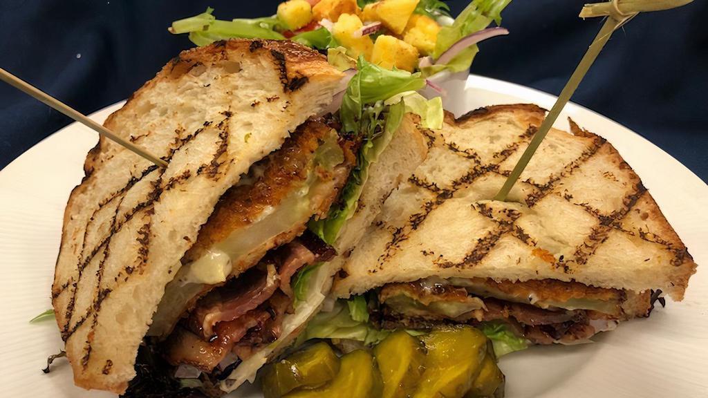 Fried Green Tomato Blt · Pecan-smoked bacon, green onion aioli, red onion, lettuce, and arugula served on Texas toast.