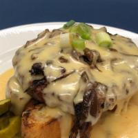 Bubba Rarebit · Open-faced burger on Texas toast, topped with caramelized onion and smothered in Cheddar che...