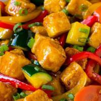 Spicy Tofu · Slices of tofu stir-fried with bell pepper, onion, carrot, and mushroom in a spicy sauce.