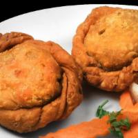 Vegetable Samosa · Mixed vegetables and potatoes, spices wrapped in pastry saved with a special sauce; served w...