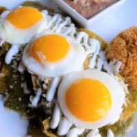 Chilaquiles Verdes · A traditional Mexican breakfast dish. Crispy tortillas simmed with salsa verde and onions. T...