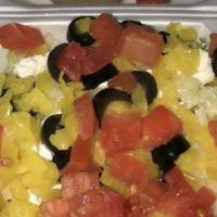 Large Greek Salad · Lettuce, feta cheese, onions, mild peppers, black olives and tomatoes.