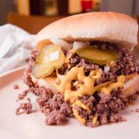 Loose Beef With Cheese · Our seasoned ground beef, onions, mustard and pickles on a bun.
