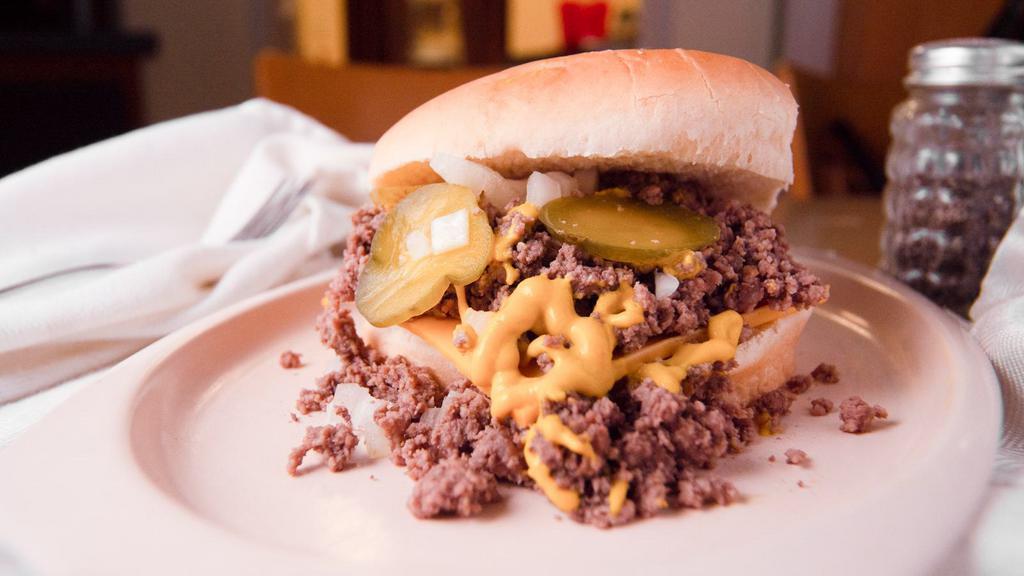 Loose Beef With Cheese · Our seasoned ground beef, onions, mustard and pickles on a bun.