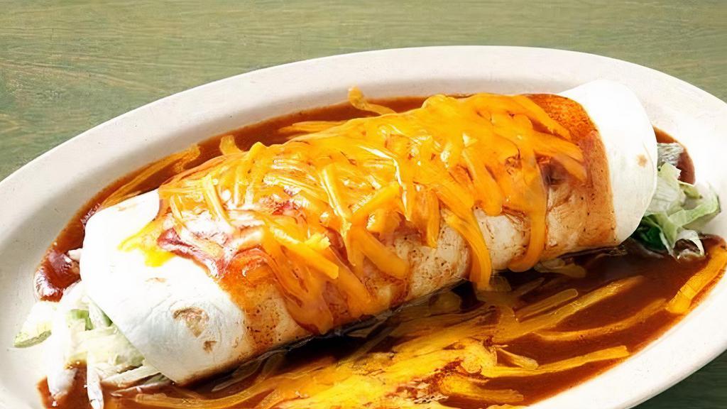Smothered Burrito · Your choice of burrito combinations covered with Talita's red enchilada sauce and melted cheddar cheese