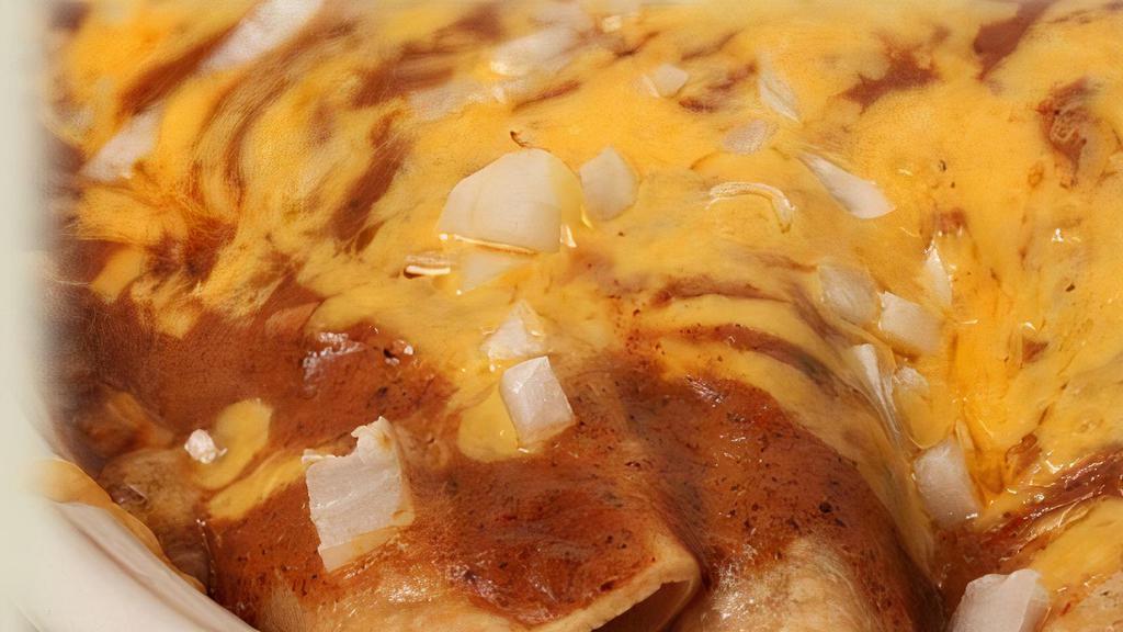 Enchilada Platter · Your choice of seasoned ground beef , shredded chicken breast or cheddar cheese rolled in a soft corn tortilla covered with Talita's red enchilada sauce melted cheddar cheese topped with diced onion and served with beans and Spanish rice