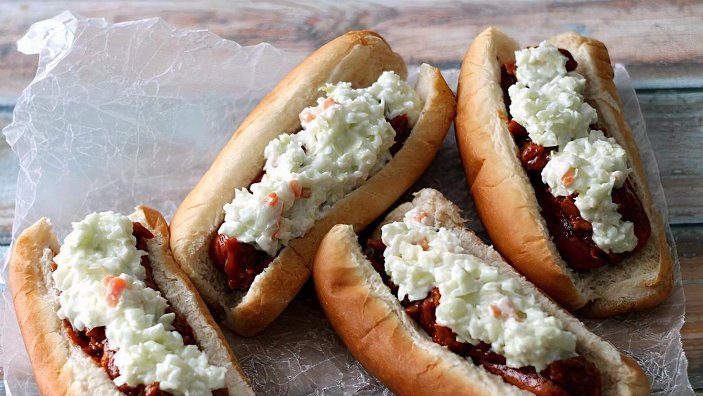 Slaw Dog · An all-beef Frank with yellow mustard,
Dad’s Coney Sauce, onions and slaw
