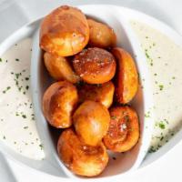 Bavarian Pretzel Bites · Bavarian-style pretzels, sea salt, roasted garlic sauce, sweet and tangy mustard sauce.