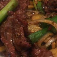 Mongolian Beef · Hot and spicy. Tender marinated flank steak mixed with green onion and onion.