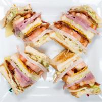 Club Sandwich · Customer favorite!  ham, turkey, hickory smoked bacon, lettuce, tomato, mayo, American & Swi...