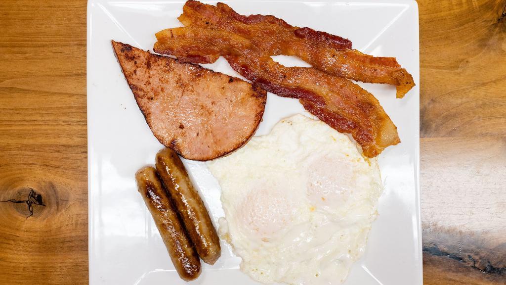 Kids Breakfast Plate · Served with two eggs any style, two sausage
links or two strips of hickory smoked bacon
and toast.