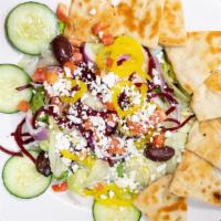 Greek Salad · Best seller! Mixed greens, tomato, cucumber, pepperoncini, kalamata olives, onion, beets & F...