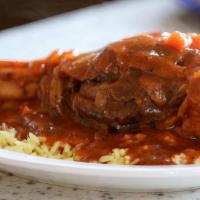 Lamb Shank · Baked and simmered in out special tomato sauce. Served over rice.