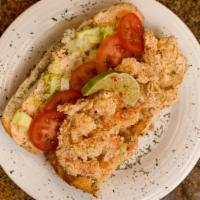 Shrimp Po'Boy · A famous New Orleans-style sandwich stuffed with golden -crispy-fried-shrimp on French bread...