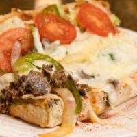 Philly Cheesesteak · The famous sandwich is made with tender slices of steak, caramelized onions, green pepper, a...