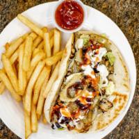 Gyro Sandwich · This world-famous Greek sandwich consists of grilled-seasoned gyro meat, onions, tomatoes, f...