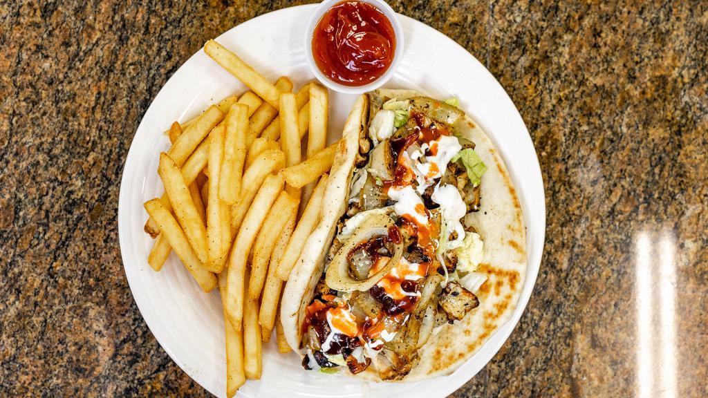 Gyro Sandwich · This world-famous Greek sandwich consists of grilled-seasoned gyro meat, onions, tomatoes, feta cheese, tzatziki sauce, served on pita bread.
