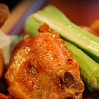 Village Wings · Available Hot, Jerk (spicy), BBQ or Plain. Served with sauce for dipping.
