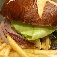 Amstel Gourmet Pub Burger · Village Tavern & Grill Signature Item.  10oz premium cut ground chuck hand padded, char-gril...