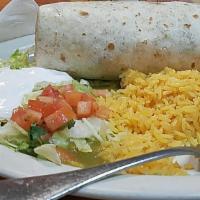 Burrito Dinner Suizo · Filled with beans, cheese, lettuce, tomato and your choice of chicken, ground beef, steak, p...
