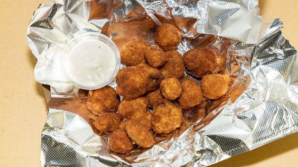 Breaded Mushrooms · Tavern-style breaded mushroom served with a side of ranch dressing.