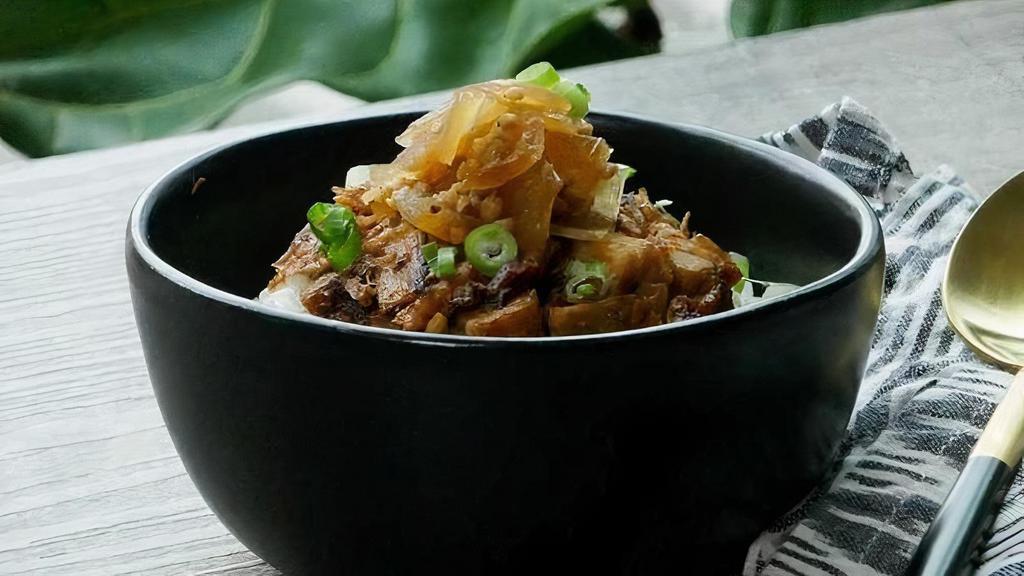 Pork Belly Rice · Chopped seared pork belly on steamed rice with a sweet onion drizzle.