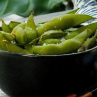 Edamame · Green soy beans served hot in the pod and seasoned with sea salt.