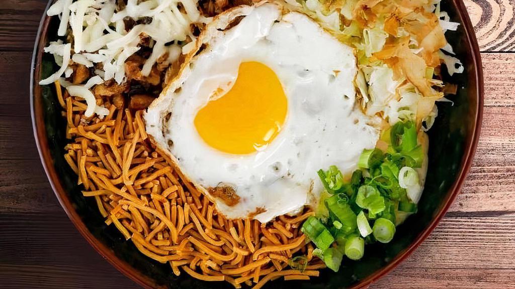 Junk Ramen · Soupless ramen noodles with all sorts of fun topping. Chopped pork belly, fried egg, shredded cabbage, mozzarella cheese, yuzu mayonnaise and crispy noodles make this a fun new way to eat ramen.