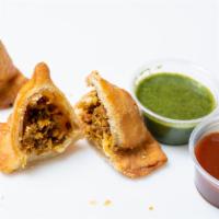 Chicken Samosa (2 Pcs) · BK handmade pastry filled with sautéed seasoned minced chicken. Served with green and red ch...