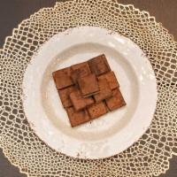 Chocolate Burfi (Fudge) · Milk based dessert topped with our signature chocolate fudge blend. (Allergens-Milk)