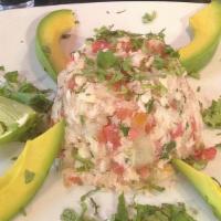 Ceviche De Pescado · cooked tilapia fish marinated with lime juice and pico de gallo topped with slices of avacad...
