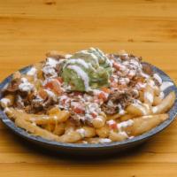 Mexican Fries · French fries topped with carne asada, guacamole, cheddar cheese, sour cream and pico de gallo.