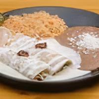 Enchiladas. · Two enchiladas stuffed with cheese and meat of choice topped with Queso or Carne Guisada.