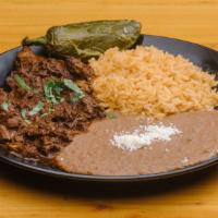 Barbacoa · Gluten-free. Traditional Veracruz style pork slows cooked with a blend of chile pasilla and ...
