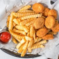 La Chiquilla · Chicken nuggets with French fries.